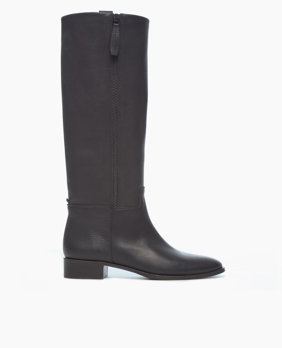 The image shows a single, tall, black leather boot with a side zipper and a low block heel against a plain white background.