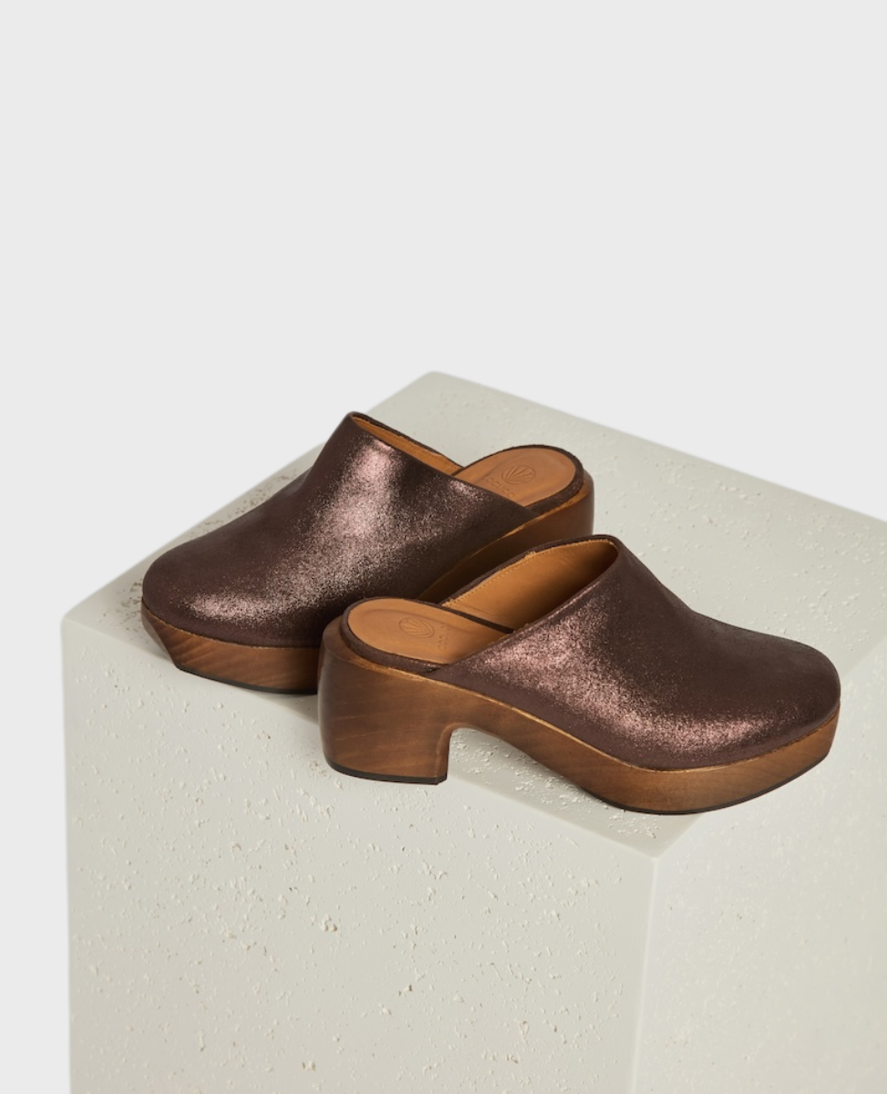 A pair of metallic brown clogs featuring a wooden platform heel and sole, and an open back design.